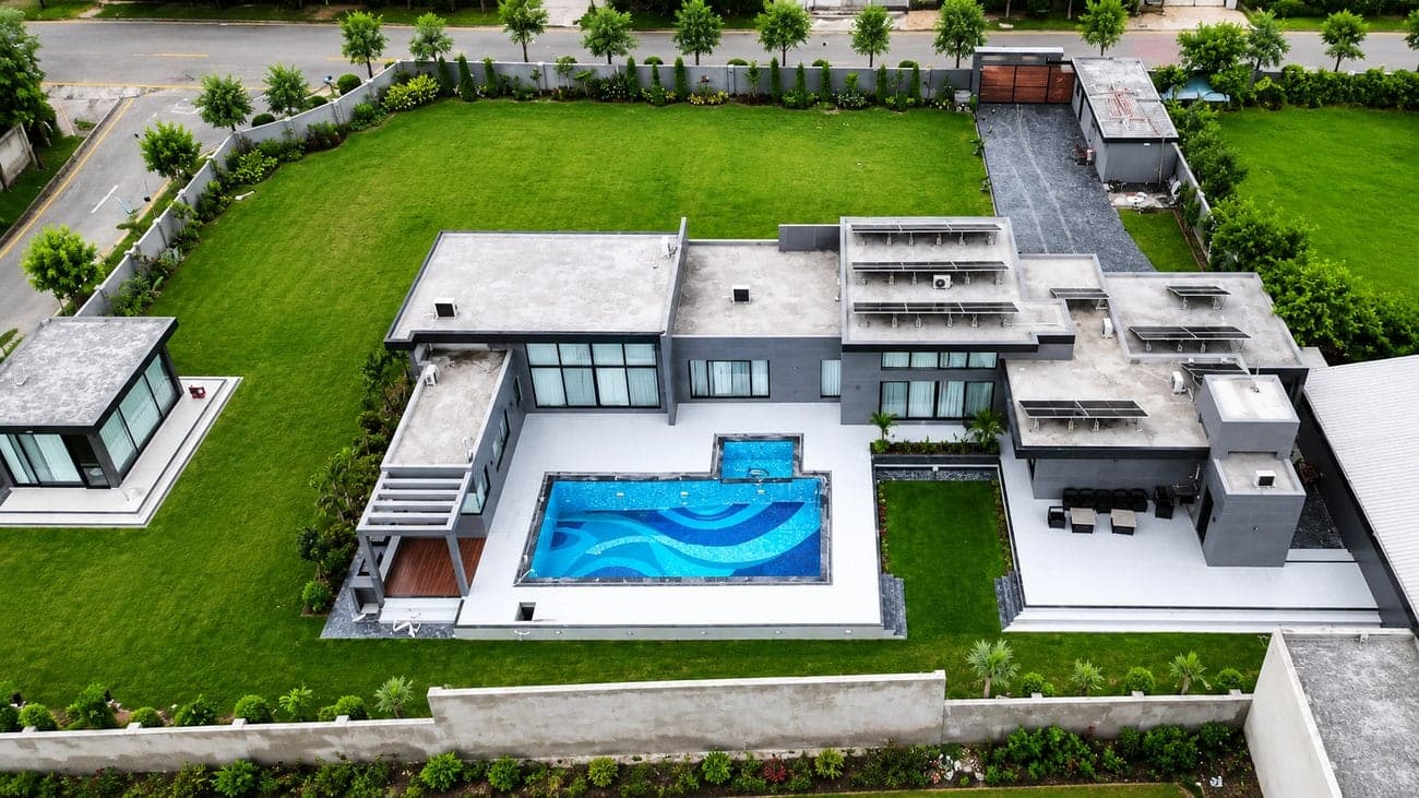 A private farmhouse estate with swimming pool and landscaped lawns at Palm Valley Farms